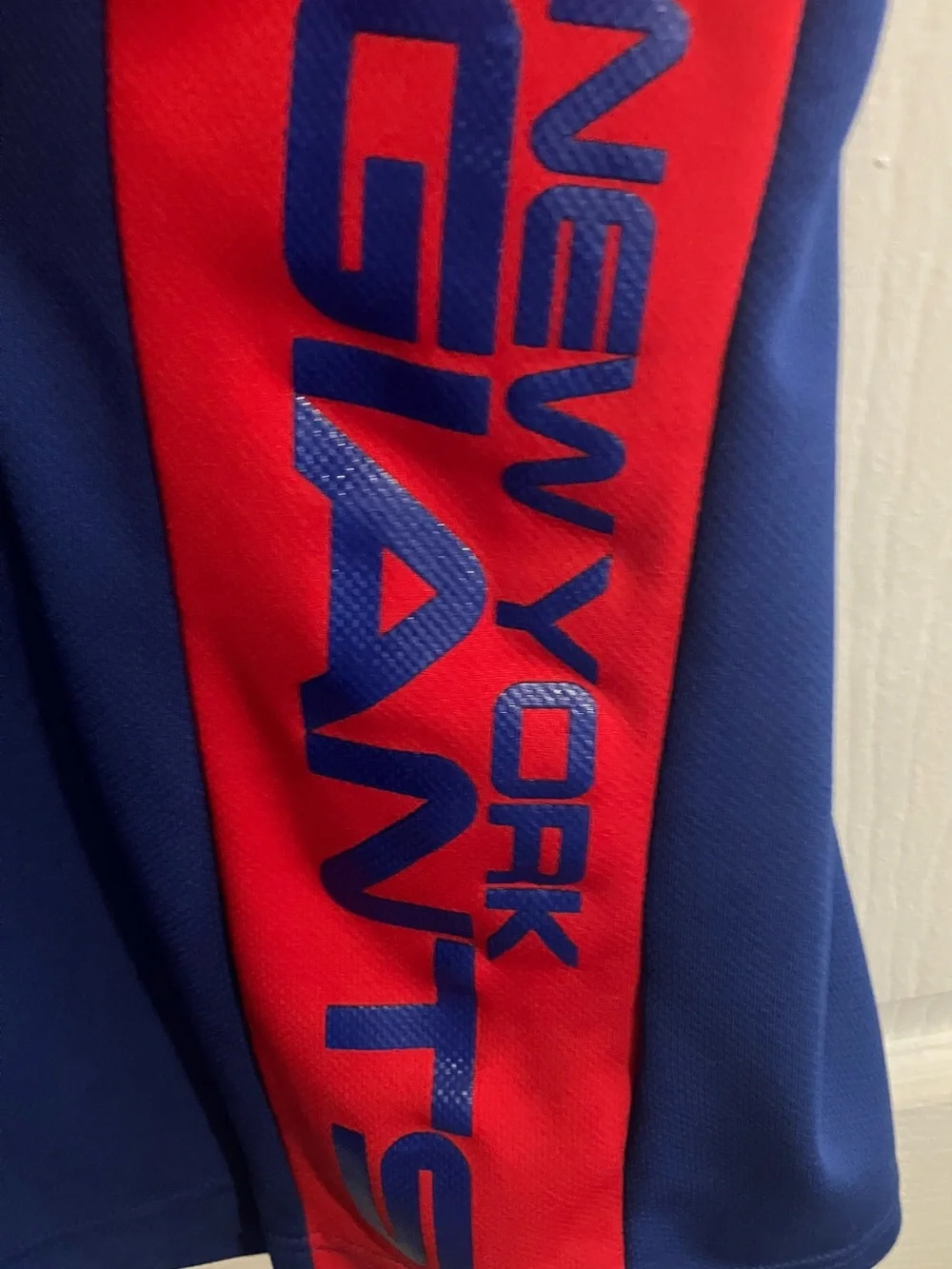 Youth New York Giant’s Royal Blue Polo with Red Side Panels Size M